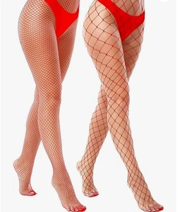 Detail view of red fishnet tights showing different mesh sizes and elastic texture
