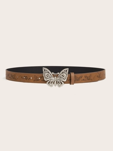 Detail of brown leather belt featuring silver butterfly buckle and embossed floral patterns