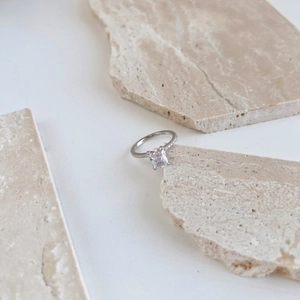 Macro shot of S925 sterling silver stamp on rectangle cut zircon wedding ring
