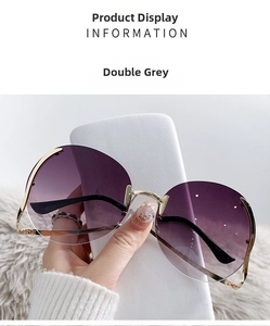 Detail view of purple gradient rimless sunglasses with gold metal temples and nose bridge