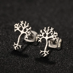 Macro detail of silver tree of life stud earrings with intricate hollow-out design