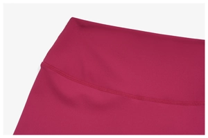 Detail of high-waist yoga shorts showing professional stitching in rose red fabric