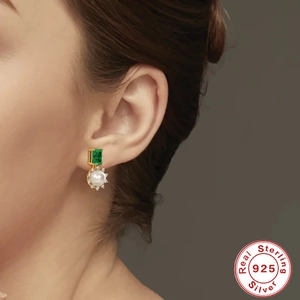 Elegant S925 sterling silver hoop earrings with marquise emeralds and round white pearls