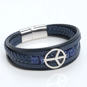 Detail of blue multi-layer braided leather bracelet with silver peace sign and magnetic clasp