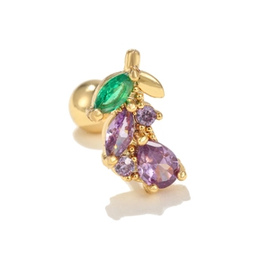 Macro detail of a grape-shaped stud earring with purple and green cubic zirconia