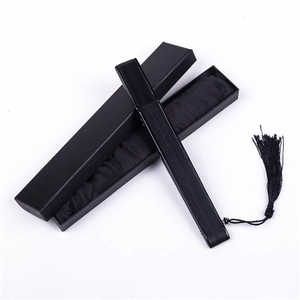Classic black lacquer folding fan with matching tassel and elegant gift box packaging