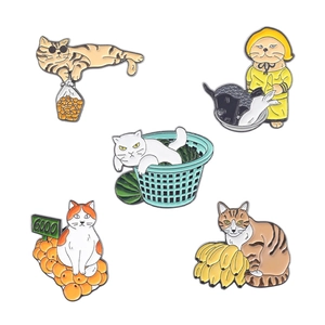 Set of five creative cat enamel pins featuring fruit themes on a clean white background