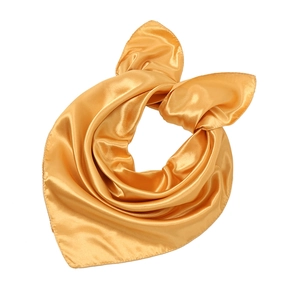 Macro detail of golden satin square scarf showing glossy fabric and fine edge stitching