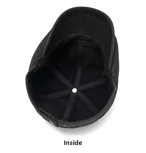 Internal structure of wool newsboy hat featuring six-panel stitching and sweatband