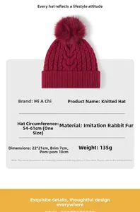 Detail of burgundy winter knit hat featuring a large 10cm faux rabbit fur pom pom