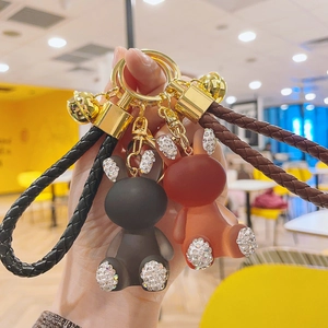 Cute resin bear keychains in black and brown with rhinestones and woven leather straps