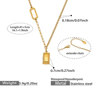 Macro shot of gold stainless steel necklace detail featuring LOVE engraved pendant