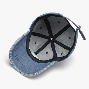 Inner view of washed light blue denim baseball cap with 100% cotton stitching details
