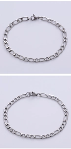 Detail of silver Figaro chain link necklace in 3+1 pattern with lobster clasp closure