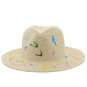 Artistic graffiti straw panama hat with colorful paint splatters and wide brim