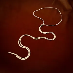 Minimalist gold plated stainless steel snake bone chain necklace in fluid wave pattern