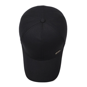 Classic black cotton baseball cap with side metal emblem and curved sun visor for men