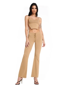 Two-piece camel ribbed knit set featuring a cropped camisole top and flared trousers