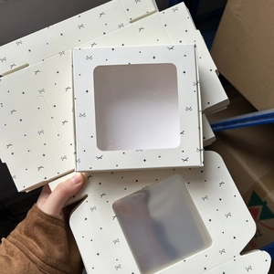Cream square window gift box with black star and bow patterns for hair accessories