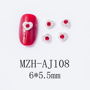 Detailed macro view of red heart rhinestones for nail art measuring 6x5.5mm size