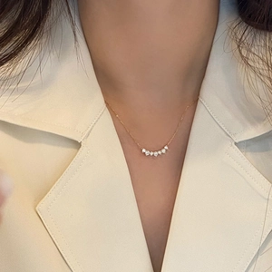 S925 sterling silver 18K gold plated smile necklace with cubic zirconia on model
