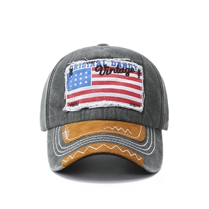 Close-up of vintage denim baseball cap with American flag patch and distressed detailing
