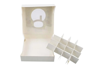 Detail showing 12-compartment white cardboard gift box with removable dividers