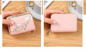 Detailed view of pink PU leather coin purse with floral embroidery and golden clasp