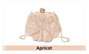 Detailed macro view of the apricot floral acrylic evening bag with gold sphere clasp