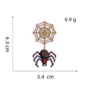 Detail view of spider web embroidery patch with size measurements 6.3cm and 3.4cm