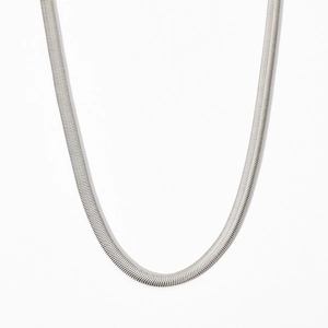 Minimalist silver flat snake chain necklace with smooth herringbone metal texture