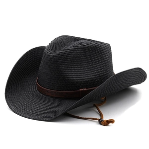 Detail of black straw cowboy hat featuring vintage brown embossed band and windproof rope