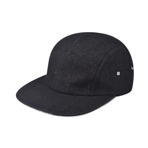 Detailed view of the black denim texture and silver air vents on a 5-panel camper hat