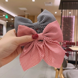 Classic red and black gingham bow hair clips set made of soft fabric for women