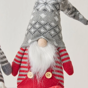 Christmas gnome doll with grey knit snowflake hat and red striped body for holiday decor