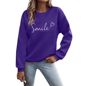 Deep purple long sleeve sweatshirt featuring a white Smile print and heart graphic