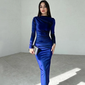 Detail of royal blue velvet dress showing slim-fit ruched waist and elegant long sleeves