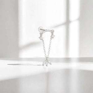 Detail of S925 sterling silver cartilage stud with chain and marquise gems