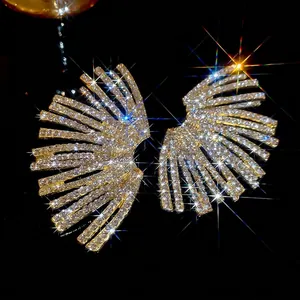 Sparkling gold fan-shaped stud earrings with radiant rhinestones for a glamorous look