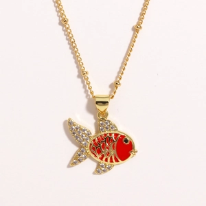 Gold-plated fish necklace with red enamel and crystals on a delicate bead chain