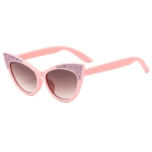 Pink cat eye children sunglasses with glitter frame and gradient lenses in 45-degree view
