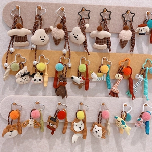 Collection of handmade plush animal keychains in various styles and colorful woven ropes