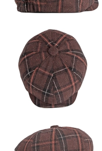 Detail view of brown plaid newsboy hat featuring retro wool texture and octagonal stitching