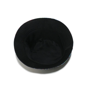 Interior detail of a black sun hat featuring premium lining and vibrant printed brim edge