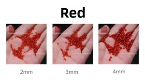 Three sizes of red silver-lined glass seed beads held in palm for DIY jewelry making