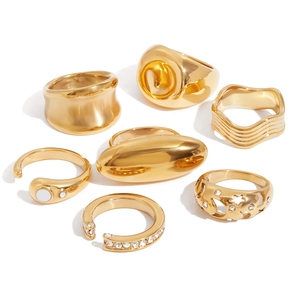 Detailed set of 7 gold titanium steel rings with natural stone and diamond accents