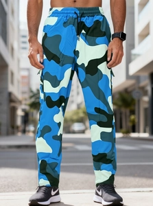 Detail of men's blue camouflage cargo pants with cuffed hem and side utility pockets