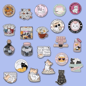 Enamel cat pins set with various breeds and funny slogans on a light blue background