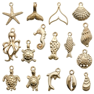 Golden ocean animal charms collection featuring starfish, sea turtles, and shells