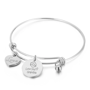 Adjustable silver wire bangle with heart pendant and Love You Grandma engraving charms